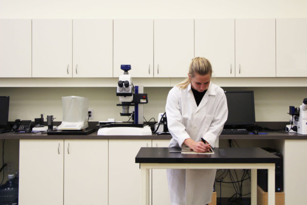 woman in lab coat working
